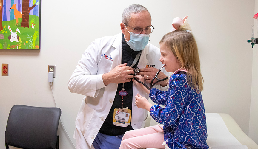 Patient with stethoscope listens to doctor's chest